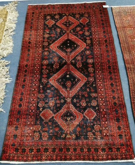 A Baluchi carpet 174 x 95cm